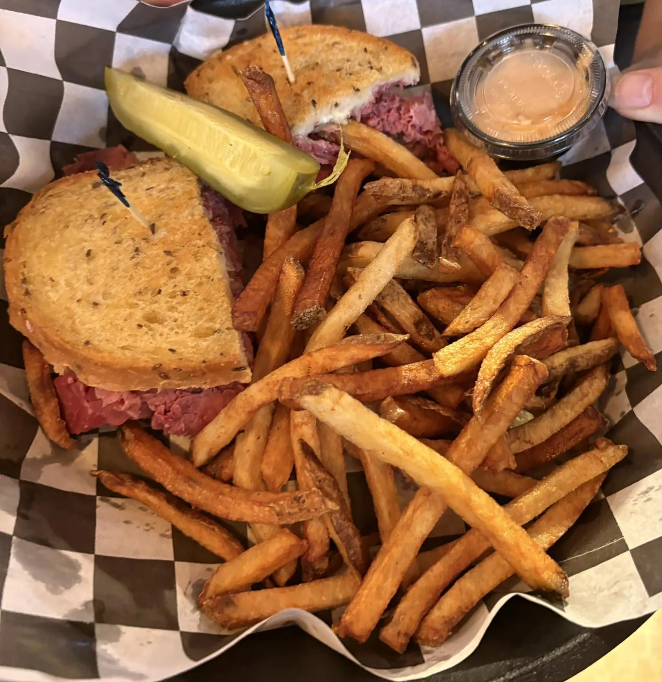 Pastrami on rye with hand-cut fries and a pickle